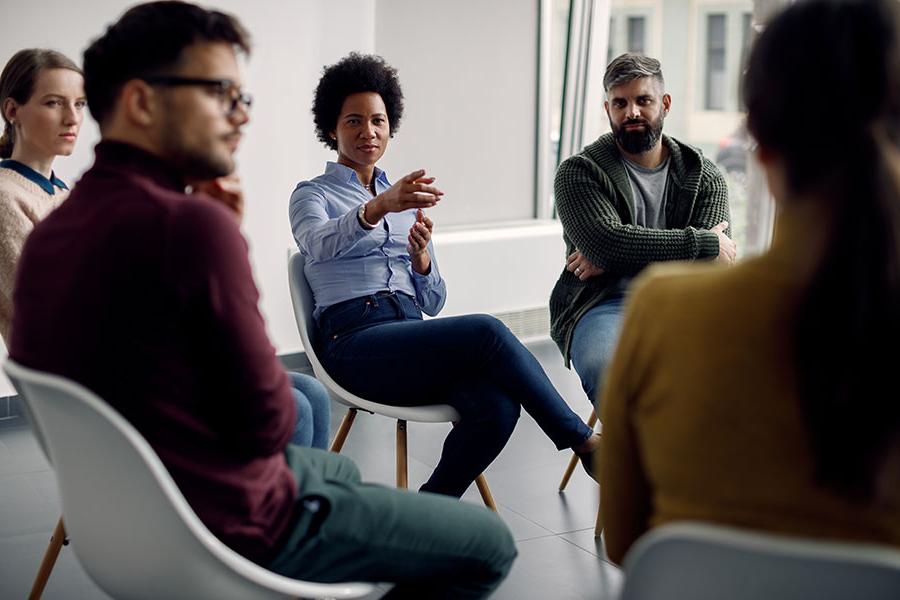 Students in a circle having conversation